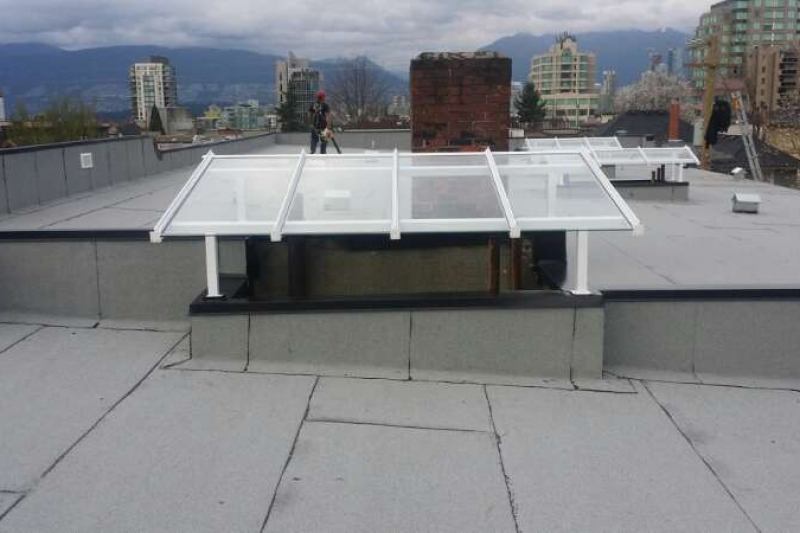Roofer on flat roof