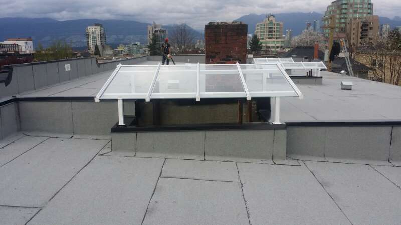 Roofer on flat roof