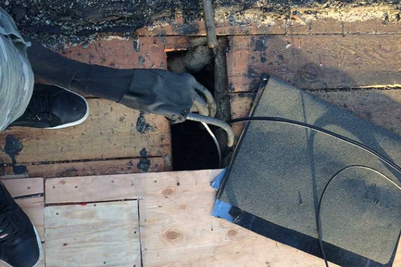 sealing flat roof wiring and vents