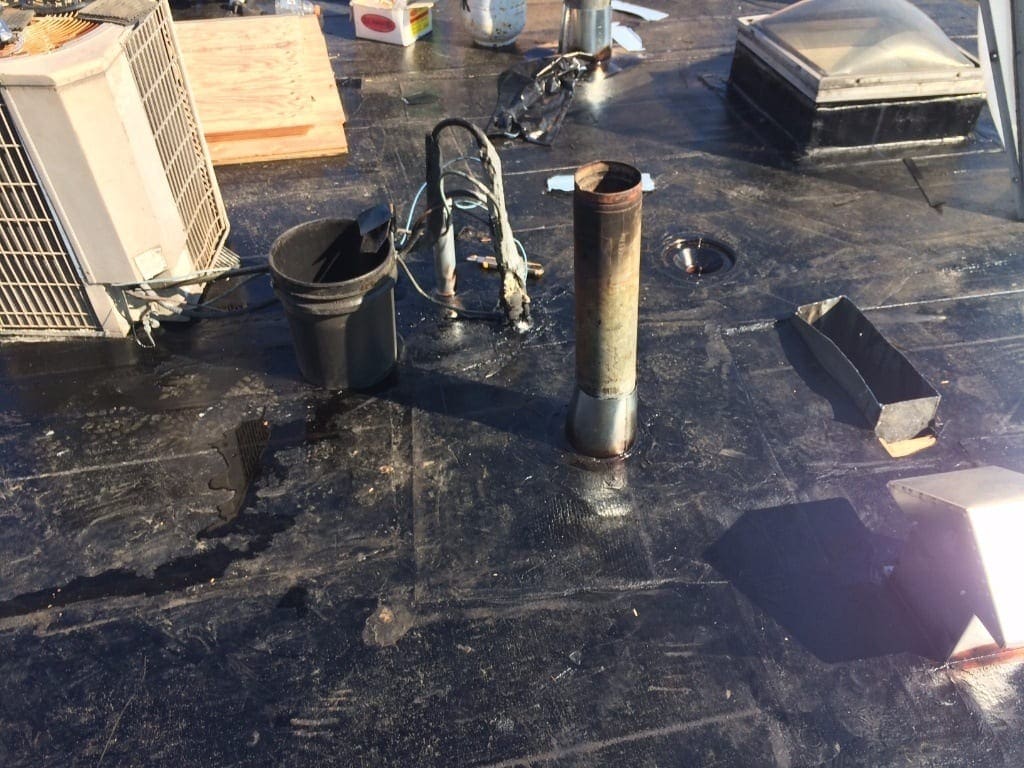 sealing vents on torch on commercial roof