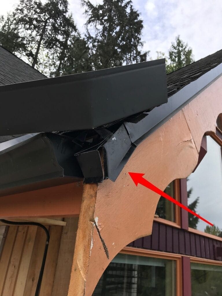 poor roofing job - metal bent